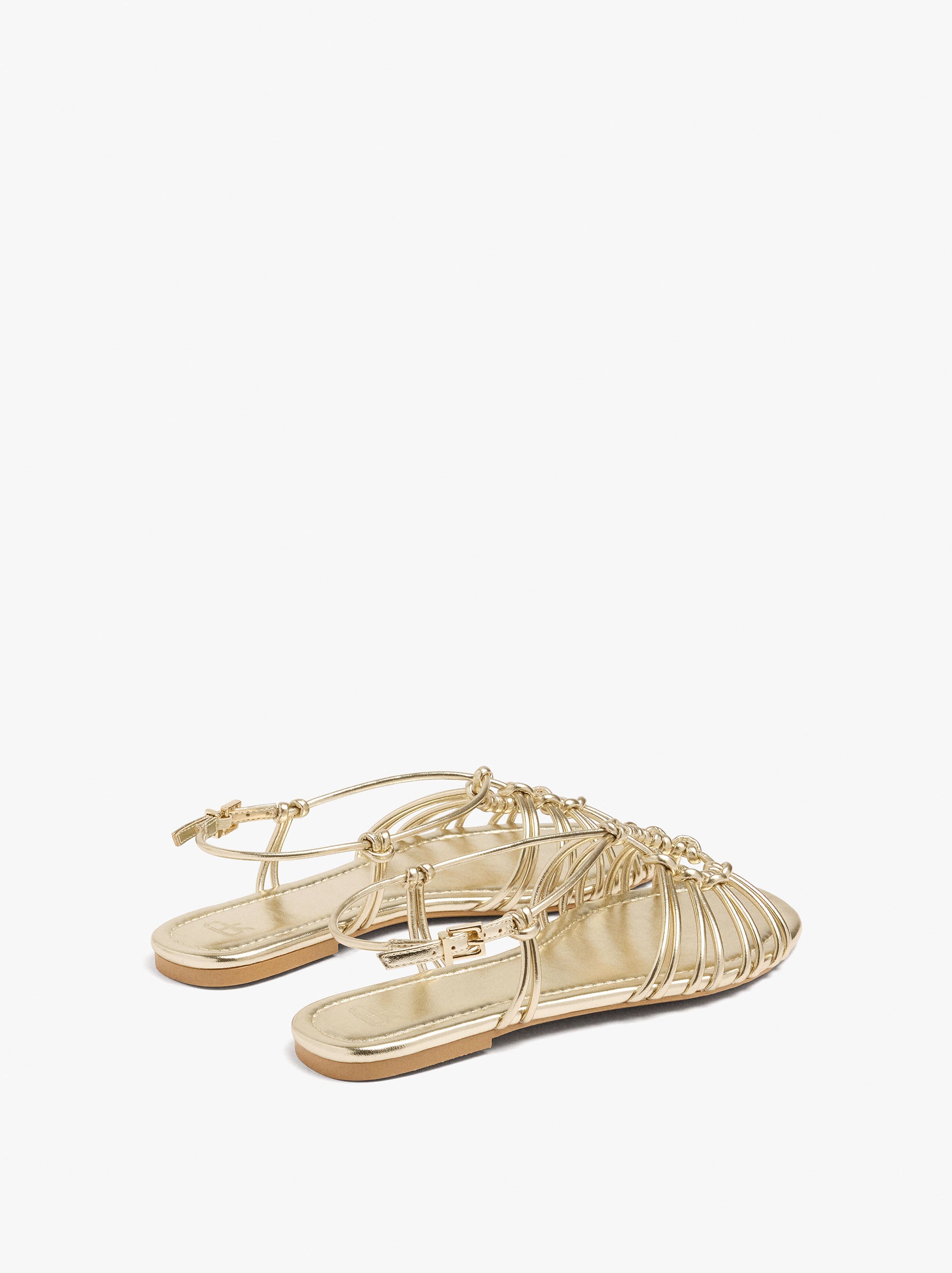 Sandalias Planas Metalizadas Con Nudos
